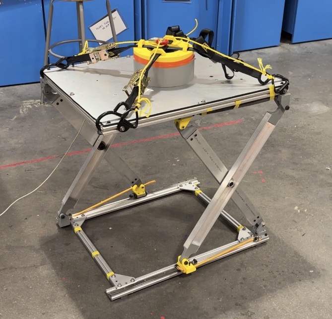 Active suspension scissor-lift prototype on a workbench