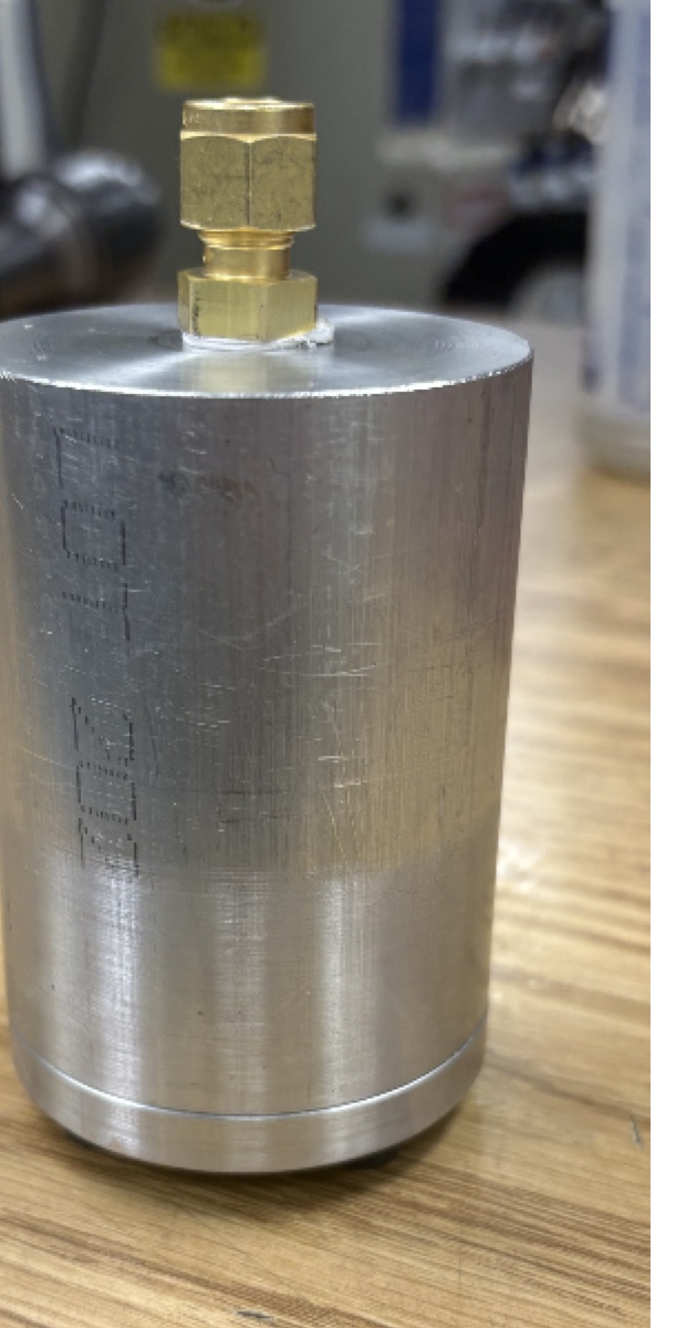 Final machined aluminum pressure vessel with brass fitting